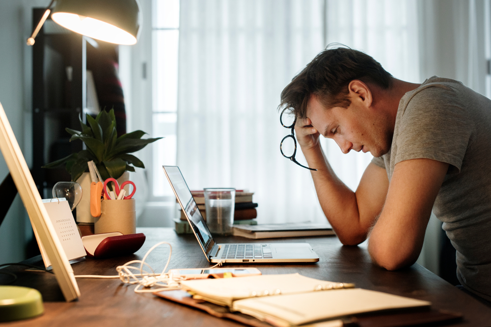 Man,Stressed,While,Working,On,Laptop